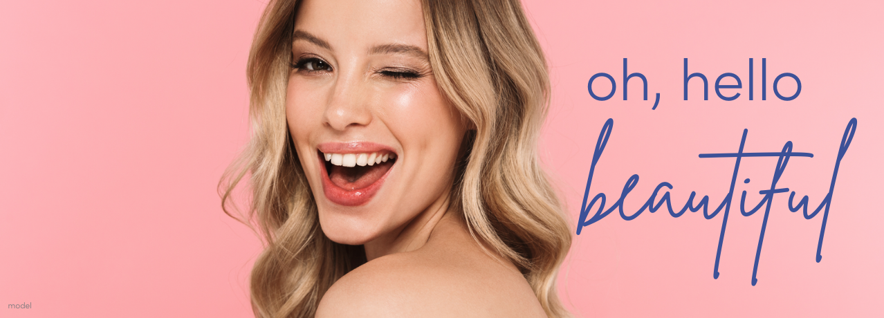 hello beautiful - blonde woman winking at camera